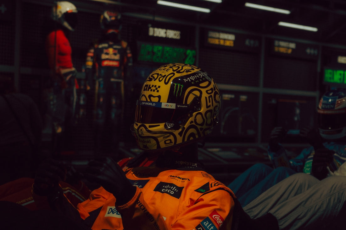 Yellow racing helmet with black doodles and white designs
