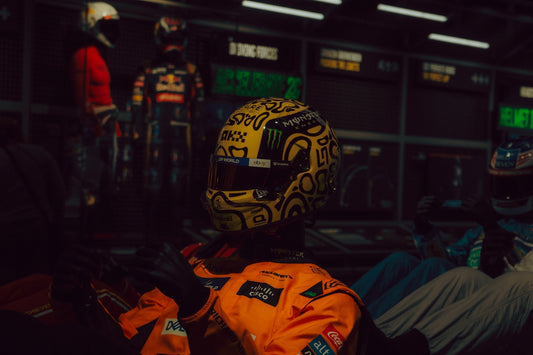 Yellow racing helmet with black doodles and white designs