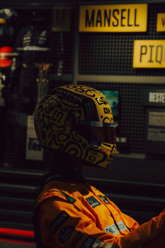Racing helmet and suit on display