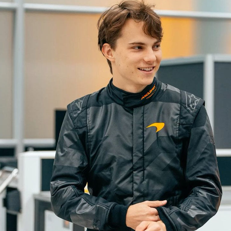 Premium Oscar Piastri McLaren Stealth Formula 1 racing suit for motorsport enthusiasts.